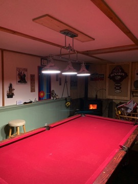 Paulson pool table and pellet stove